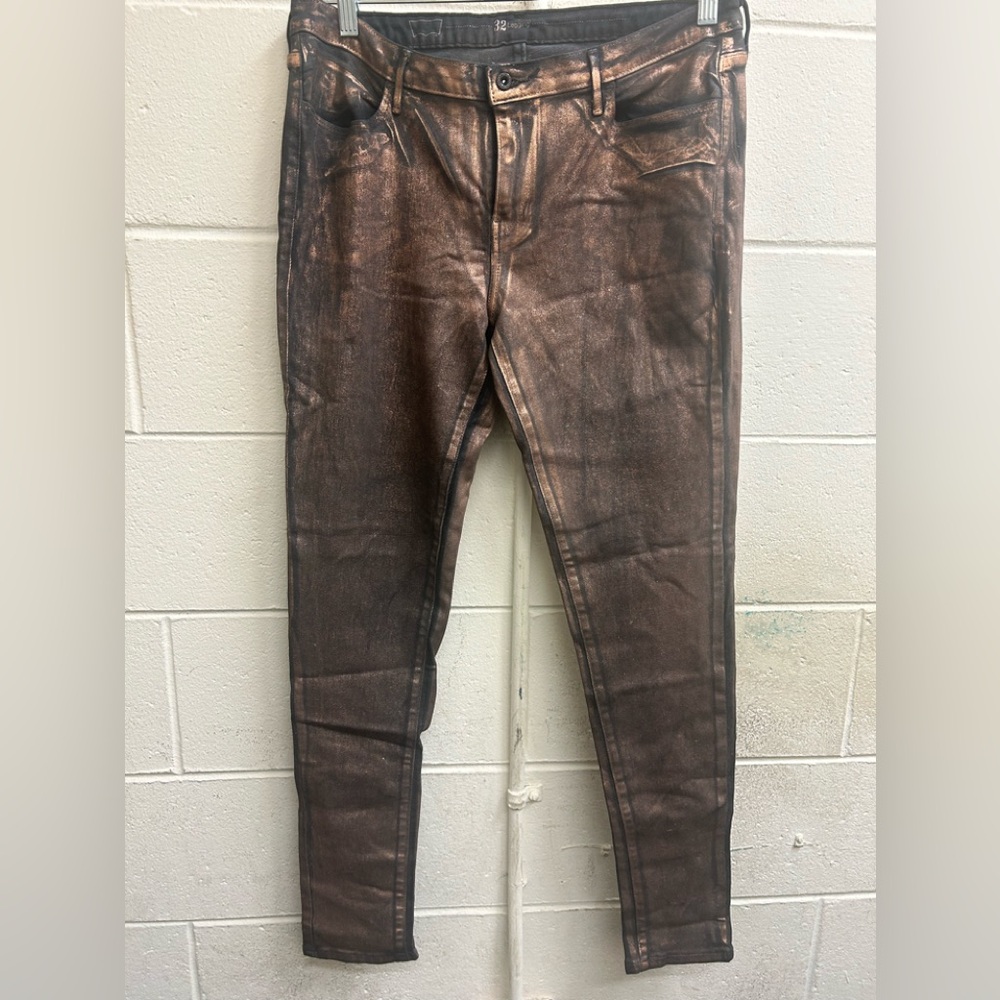 Levi Strauss Jean leggings 33 in copper and black. Button and zipper closure